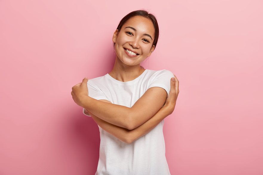 A women hugging herself